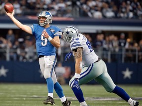 Windsor's Tyrone Crawford, right, chases Detroit Lions quarterback Matthew Stafford during the Cowboys' 24-20 playoff win over Detroit.
