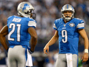 Lioins quarterback Matthew Stafford, right, reacts to a call alongside running back Reggie Bush against the Dallas Cowboys during the NFC Wild-card Game at AT&T Stadiu  in Arlington, Tex. (Photo by Ronald Martinez/Getty Images)