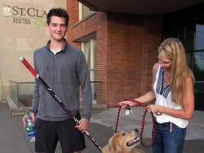 Spits forward Logan Brown, arrives in Windsor with his mother Laina Brown and pet golden retriever Ryder. (NICK BRANCACCIO/The Windsor Star)