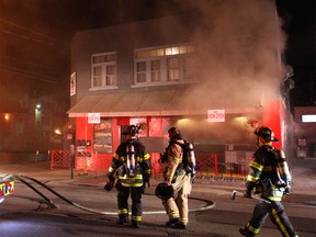 Firefighters at the scene of a blaze at 943 Ottawa St. on Nov. 8, 2014. (Dax Melmer / The Windsor Star)