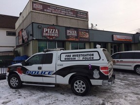 Windsor police arson investigators investigate the aftermath of a fire at 1129 Wyandotte St. E. on Jan. 8, 2015. (Dan Janisse / The Windsor Star)