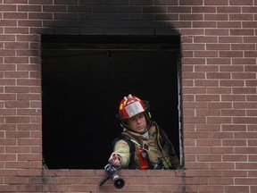 Windsor firefighters put out fire at 333 Glengarry Ave on Saturday, Jan. 3, 2014. (DAX MELMER/The Windsor Star)