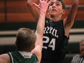 Lajeunesse' Ali Aoude takes a jump shot over Belle River's Nevin Novacco during WECSSAA boys basketball action between the Belle River Nobles and the E.J. Lajeunesse Royals at Belle River High School, Friday, Jan. 30, 2015.   (DAX MELMER/The Windsor Star)