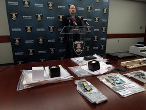 Const. Rob Durling speaks during a press conference at police headquarters in Windsor on Thursday, January 15, 2015. Four people have been charged in relation to the credit card frauds after employees at the Bay called police when they tried to purchase gift cards.      (TYLER BROWNBRIDGE/The Windsor Star)
