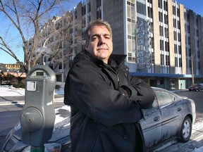 Downtown restaurateur Mark Boscariol is angry about a plan to eliminate some free parking perks in municipal parking garages downtown. He is shown Wed. Jan. 7, 2015, in front of his restaurant on Chatham St. E. which is across the street from a parking garage that currently offers one hour of free parking.   (DAN JANISSE/The Windsor Star)