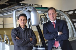 University of Windsor associate professor Narayan Kar, left, and Unconquered Sun founder and CEO Sean Moore, with a solar-powered, 11-passenger bus at Unconquered Sun on January 8, 2015, worked together to develop new solar powered electric vehicle technology that extends the range of solar-powered vehicles. (JULIE KOTSIS/The Windsor Star)