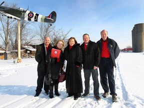 Members of the Essex Memorial Spitfire Committee pose Wednesday, Jan. 14, 2015, in downtown Essex, ON. From left, Joe Gibson, Monica Totten, Suzanne Allison, Randy Voakes and Mike Beale are working on building an Essex RAF/RCAF Honour Wall near the recently installed Spitfire aircraft.  (DAN JANISSE/The Windsor Star)