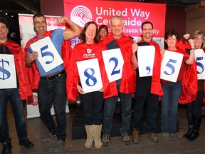 Local employees with Ford Motor Company have donated more than $50 million to the United Way of Windsor-Essex County over the last 35 years. A media conference was held Friday, Jan. 9, 2015, in the Windsor Star News Cafe to mark the milestone with the theme of "Everyday Hero". Caped Ford workers from left display the 2014 donation of $582,551. They are from left, Arlindo Rocha, Jay Cannon, Deb Shaw, Gary Maisonville, Roger Dzugan, Gayle Beaudoin, Theresa Arquette and Christie Robinson.  (DAN JANISSE/The Windsor Star)