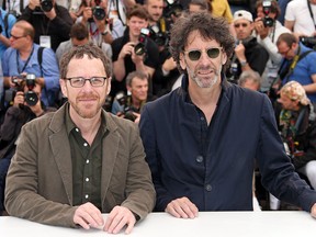 Directors Ethan Coen, left, and Joel Coen pose for photographers during a photo call for the film Inside Llewyn Davis at the 66th international film festival, in Cannes, southern France, Sunday, May 19, 2013. (Photo by Joel Ryan/Invision/AP)