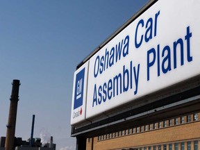 In this Monday, Sept. 17, 2012, file photo, a sign stands outside Oshawa's General Motors car assembly plant in Oshawa, Ontario. (AP Photo/The Canadian Press, Michelle Siu)
