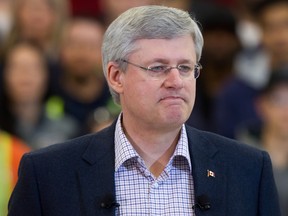 Prime Minister Stephen Harper pauses while speaking about the terrorist attack by masked gunmen in Paris, during an announcement at the British Columbia Institute of Technology Annacis Island Campus in Delta, B.C., on Thursday, Jan. 8, 2014. THE CANADIAN PRESS/Darryl Dyck