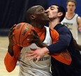 The University of Windsor Lancers Rotimi Osuntola Jr. and Mike Rocca (right) practice at the St. Denis Centre. Ranked No. 5 by the CIS, Windsor enters the OUA playoffs as the fifth-seed.