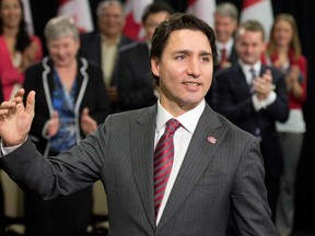 Liberal leader Justin Trudeau speaks to Liberal Members of Parliament and nominated Liberal candidates in Ottawa, Wednesday December 10, 2014. THE CANADIAN PRESS/Adrian Wyld