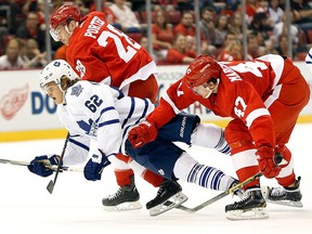 Detroit defenceman Alexei Marchenko, right, will make his season debut with the Red Wings on Saturday, Jan. 31, 2015 against the New York Islanders. (AP Photo/Paul Sancya)