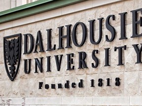 A Dalhousie University sign is seen in Halifax on Tuesday, Jan. 6, 2015. Dalhousie University says the 13 dentistry students who were allegedly members of a Facebook page where sexually violent content was posted will no longer attend classes with the rest of their classmates. THE CANADIAN PRESS/Andrew Vaughan