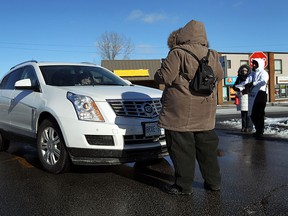 Nurses from the Ontario Nurses Association block cars from entering the parking lot of the strip mall at Tecumseh Road and Rivard Avenue in Windsor on Friday, January 30, 2015. An estimated 3,000 Community Care Access Centre nurses, including about 260 members in Windsor and Essex County, are on strike and want similar wage increase to those of other nurses in other sectors. (TYLER BROWNBRIDGE/The Windsor Star)