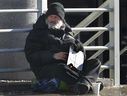 A panhandler known as Gramps panhandles for money on Ouellette Ave. on Tuesday, Jan. 6, 2015, in Windsor, ON. (DAN JANISSE/The Windsor Star)