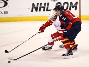 Belle River's Aaron Ekblad, right, checks Detroit's Riley Sheanan during the second period Tuesday in Sunrise, Fla. (Pat Carter/The Associated Press)