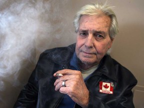 Mike Kincaid, 62, smokes a cigarette at his apartment building at 920 Ouellette Ave. in Windsor, ON. on Tuesday, Jan. 20, 2015. He completely against the proposal to ban smoking in multi-unit buildings. (DAN JANISSE/The Windsor Star)