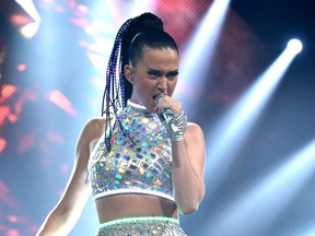 Katy Perry performs on stage at "The Prismatic World Tour" at the Honda Center in Anaheim, Calif. Perry will team with Lenny Kravitz at the Super Bowl. Perry said Saturday, Jan. 10, 2015, on NBC's Baltimore-New England telecast that Kravitz will join for the halftime show at the Sunday, Feb. 1, game in Glendale, Ariz. (Photo by John Shearer/Invision/AP, File)