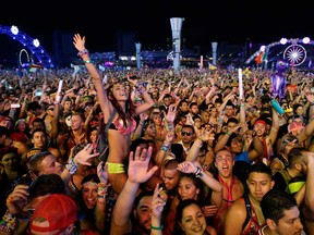 Carnival-goers dance to music by Krewella at the Electric Daisy Carnival, Saturday, June 21, 2014, in Las Vegas. (Associated Press files)