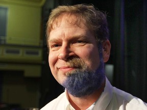 Walkerville Collegiate principal David Garlick made good on his challenge to students on Monday, Jan. 12, 2015, at the Windsor, ON. school. He promised to shave half of his beard and dye the remaining half blue. He challenged the students to donate more canned goods than last year. Garlick is shown with the finished look.  (DAN JANISSE/The Windsor Star)