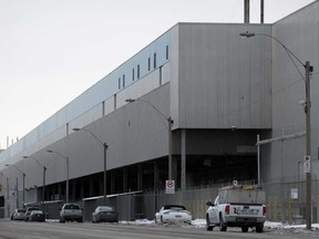 Vehicles drive by Chrysler's Windsor Assembly Plant on Jan. 16, 2015.  (DAX MELMER/The Windsor Star)