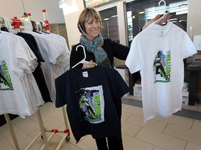 Carol Higgins shows off the Luke Willson t-shirts that are for sale at the Vollmer Centre in LaSalle on Wednesday, January 28, 2015. (TYLER BROWNBRIDGE/The Windsor Star)