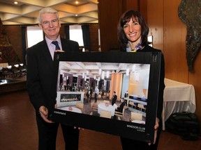 Hiram Walker & Sons and the Windsor Club announced a partnership of the Wiser's Reception Centre on Monday, Jan. 19, 2015, in Windsor, ON. Patrick O'Driscoll, President and CEO of Hiram Walker and Sons and Federica Nazzani, president of the Windsor Club pose with a conceptual drawing of the redesigned facility. (DAN JANISSE/The Windsor Star)