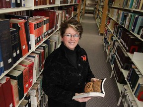 Kitty Pope, CEO of the Windsor Public Library poses at the downtown facility on Monday, Jan. 12, 2015. For story on what books local people read last year.  (DAN JANISSE/The Windsor Star)