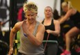 Helen Piatkowski, left, takes part in the World's Largest Simultaneous Group Workout at Bryan's Fitness Inferno, Saturday, Jan. 3, 2014.  (DAX MELMER/The Windsor Star)