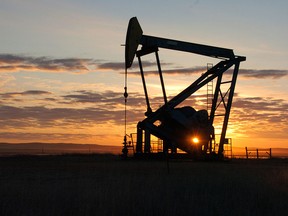In this Nov. 6, 2013, file photo, a Whiting Petroleum Co. pump jack pulls crude oil from the Bakken region of the Northern Plains near Bainville, Mont. Oil’s rapid decline in the second half of the year has pushed gas to below $3 a gallon in the U.S., the lowest price in nearly five years, and has also cut the price of other fuels. (AP Photo/Matthew Brown, File)