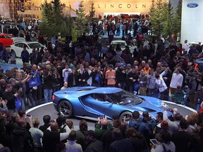 Visitors to the North American International Auto Show get a closeup look at the Ford GT on the opening day of the show, Saturday, Jan. 17, 2015.  (DAX MELMER / The Windsor Star)