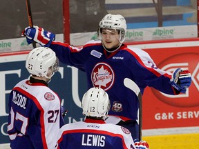Windsor Spitfires Logan Brown celebrates his goal against Owen Sound with teammates Hayden McCool, left, and Jamie Lewis in OHL action at WFCU Centre Thursday February 5, 2015. (NICK BRANCACCIO/The Windsor Star)