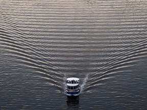 A water taxi creates a wake while travelling on False Creek in Vancouver on Wednesday, February 11, 2015.