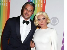 Dec. 7, 2014 file photo, Taylor Kinney and Lady Gaga attend the 37th Annual Kennedy Center Honors in Washington.