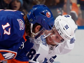 Windsor's Matt Martin, left, chats with Phil Kessel of the Toronto Maple Leafs prior to a faceoff in the first period at the  Nassau Veterans Memorial Coliseum Thursday in Uniondale, N.Y.  (Photo by Bruce Bennett/Getty Images)