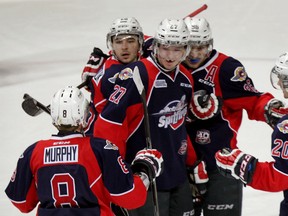 Windsor's Trevor Murphy, from left, Sam Povorozniouk, Hayden McCool, Cristiano DiGiacinto and Andrew Burns celebrate a goal against the Kitchener Rangers at the WFCU Centre. (NICK BRANCACCIO/The Windsor Star)
