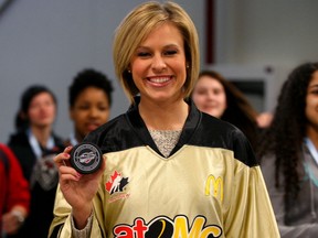 Olympian Tessa Bonhomme received a souvenir Windsor Spitfires puck at the game against the Kitchener Rangers at the WFCU Centre. (NICK BRANCACCIO/The Windsor Star)