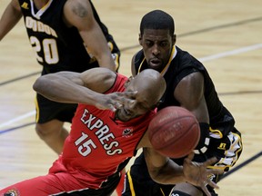 Windsor's Quinnel Brown, left, looses control against London's Emmanuel Little in NBL of Canada action at the WFCU Centre. (NICK BRANCACCIO/The Windsor Star)