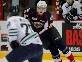 Spits Logan Brown carries toward Whalers JOSH Wesley in OHL game at WFCU Centre on Mickey Renaud Night Wednesday February 18, 2015 (NICK BRANCACCIO/The Windsor Star)