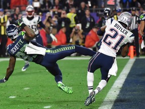 Malcolm Butler (R) of the New England Patriots intercepts a pass intended for Ricardo Lockette (L) of the Seattle Seahawks late in the fourth quarter of Super Bowl XLIX  on February 1, 2015 at University of Phoenix Stadium in Glendale, Arizona. The New England Patriots defeated the Seattle Seahawks 28-24.       AFP PHOTO /  TIMOTHY  A. CLARYTIMOTHY A. CLARY/AFP/Getty Images