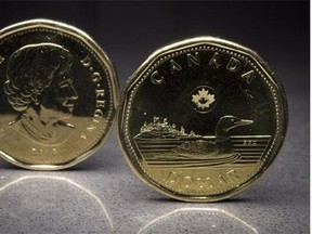 Two loonies are pictured in North Vancouver, B.C. Monday, Jan. 26, 2015. THE CANADIAN PRESS/Jonathan Hayward