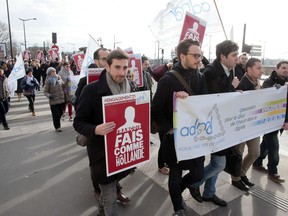 People march on January 31, 2015 to support the legalization of euthanasia, in a protest called by the Association for the Right to Die in Dignity (ADMD) in Paris. The French parliament opened on January 21 a debate on draft legislation allowing doctors to keep terminally ill patients sedated until death. The bill, which will be examined in March, is supported by President Francois Hollande, who included the controversial euthanasia issue on his election agenda. Placard reads: "Francois do like Holland(e)."                  AFP PHOTO /JACQUES DEMARTHONJACQUES DEMARTHON/AFP/Getty Images