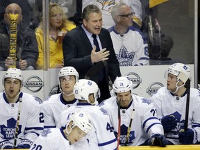 Maple Leafs head coach Peter Horachek, centre, talks to his players in the third period against the Nashville Predators Tuesday in Nashville, Tenn. (AP Photo/Mark Humphrey)