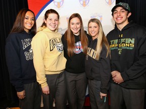 Five students at Holy Names signed athletic scholarship offers Wednesday. They are, from left, Kiana Zuk (Akron), Amber Lefler (Oakland U), Carly Fiorido (Detroit Mercy), Alicia Amante (Oakland U), and Alec D'Angela (Tiffin). (DAN JANISSE/The Windsor Star)