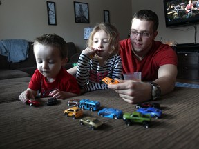 Ryan Giles plays with his Landon, 2, and Melanie, 7, at their LaSalle, Ontario home  on January 28, 2015.  (Jason Kryk/ The Windsor Star)