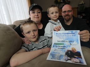 Cameron Cadorette, left along with his family Nicole Cadarette, Aaron Cadarette and Jason McMillan, are seen their Windsor, Ontario home on January 29, 2015. (JASON KRYK/The Windsor Star)