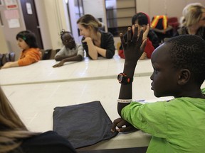 Makol Thiomg answers a question during an after school program at Water World in Windsor on Thursday, February 5, 2015. (TYLER BROWNBRIDGE/The Windsor Star)