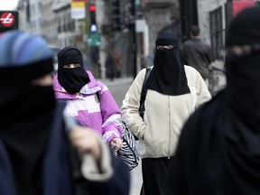 MONTREAL, QUE. APRIL 17 2010. In this file photo, about 120 people turned up Saturday afternoon outside Montreal city hall to express their opposition to Bill 94, saying the legislation reflects cultural xenophobia and has no place in Quebec society. The legislation, which would predominantly affect women who wear the Islamic niqab or burka, would require public employees, education and health workers to have their faces uncovered at all times. The law would also apply to anyone seeking government services. Saturday's protest, organized by a group calling itself simply "Kill Bill 94", lasted for about two hours and drew representatives from the South Asian Women's Association, Jewish organizations, and Montreal's Anglican diocese. (THE GAZETTE/ Allen McInnis)